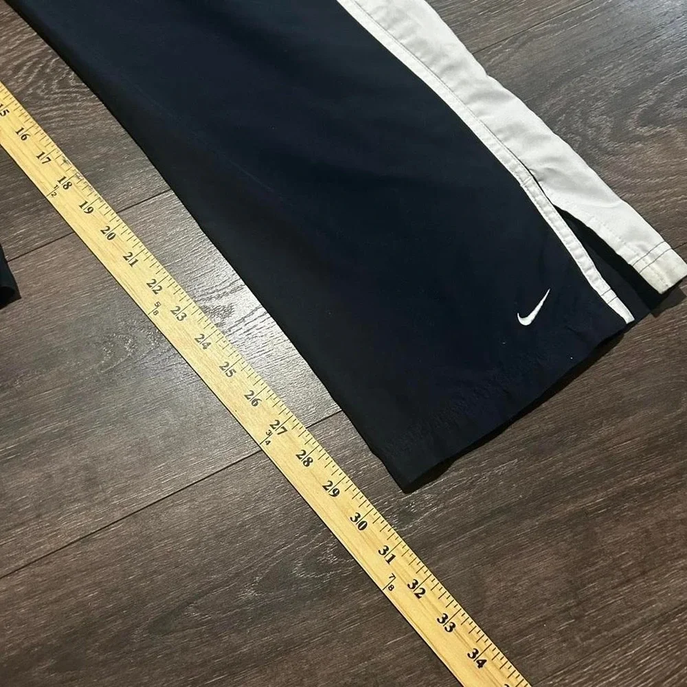 Y2K women's Nike grey tag navy blue and white baggy flare track pants Size M